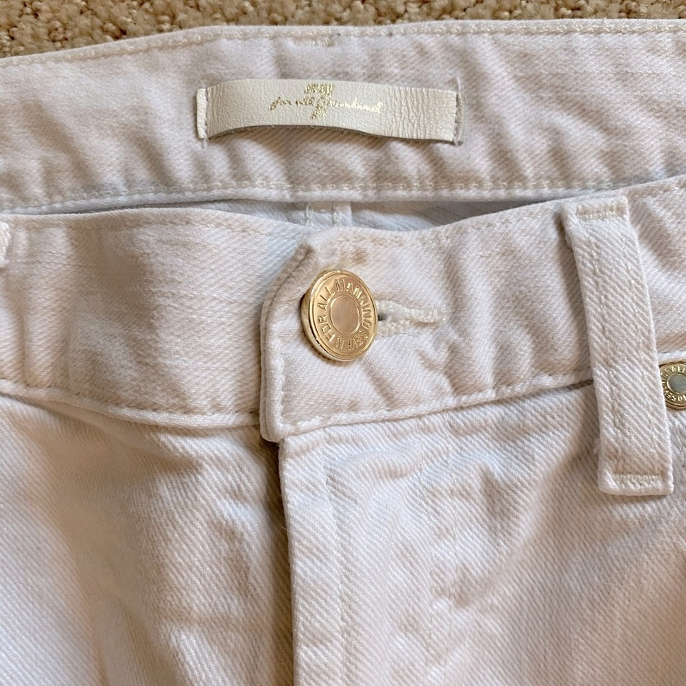 Bright white distressed jeans. 7 for all Mankind.